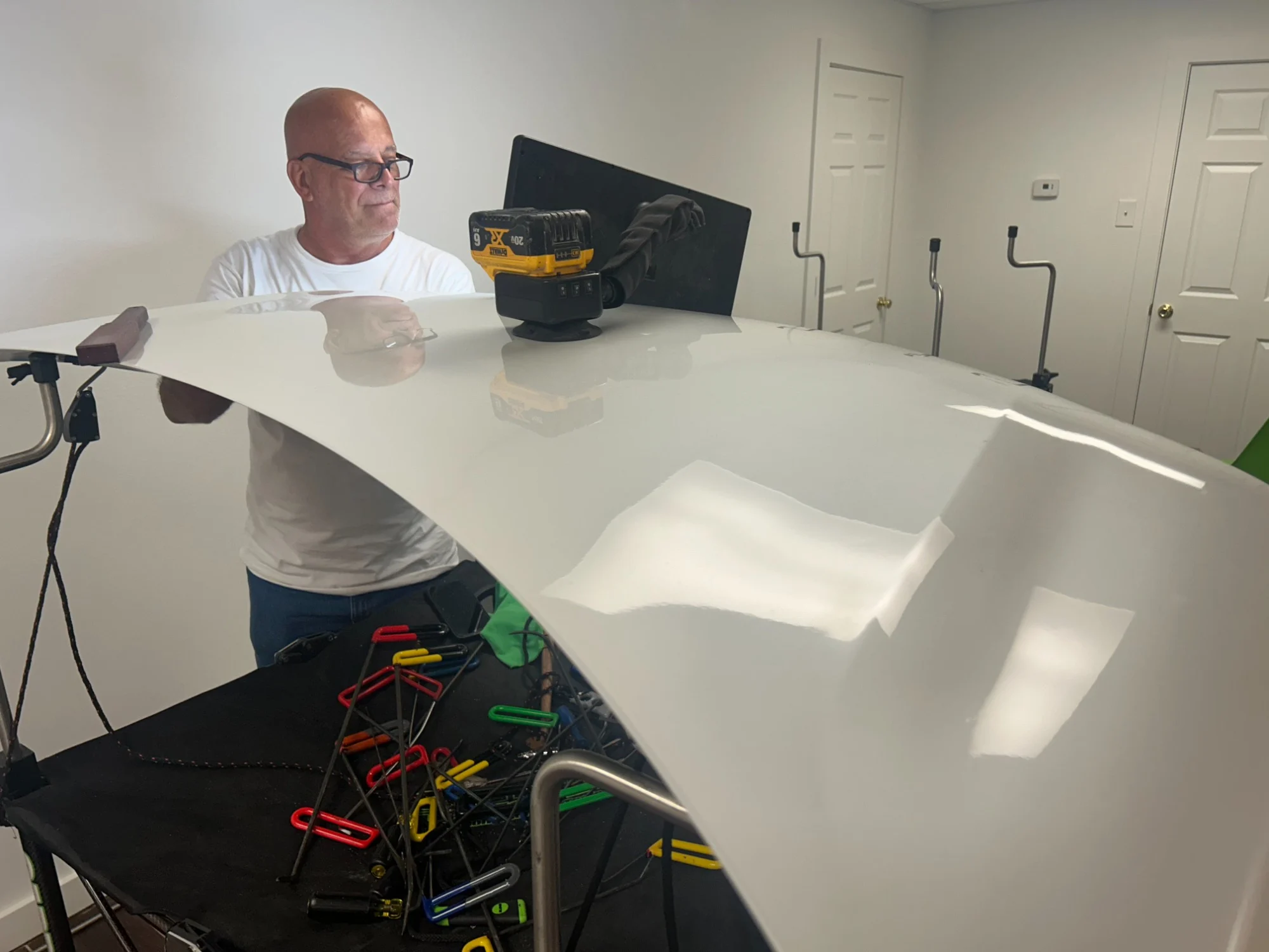 Technician working on a vehicle panel