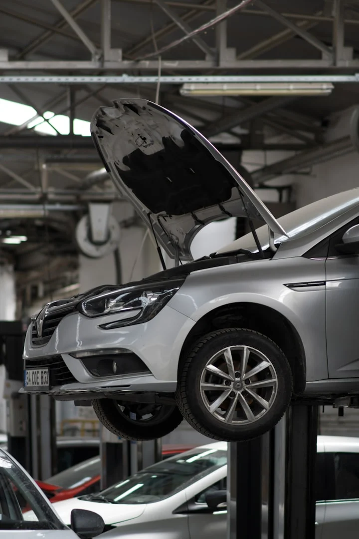 Vehicle raised in a workshop for inspection
