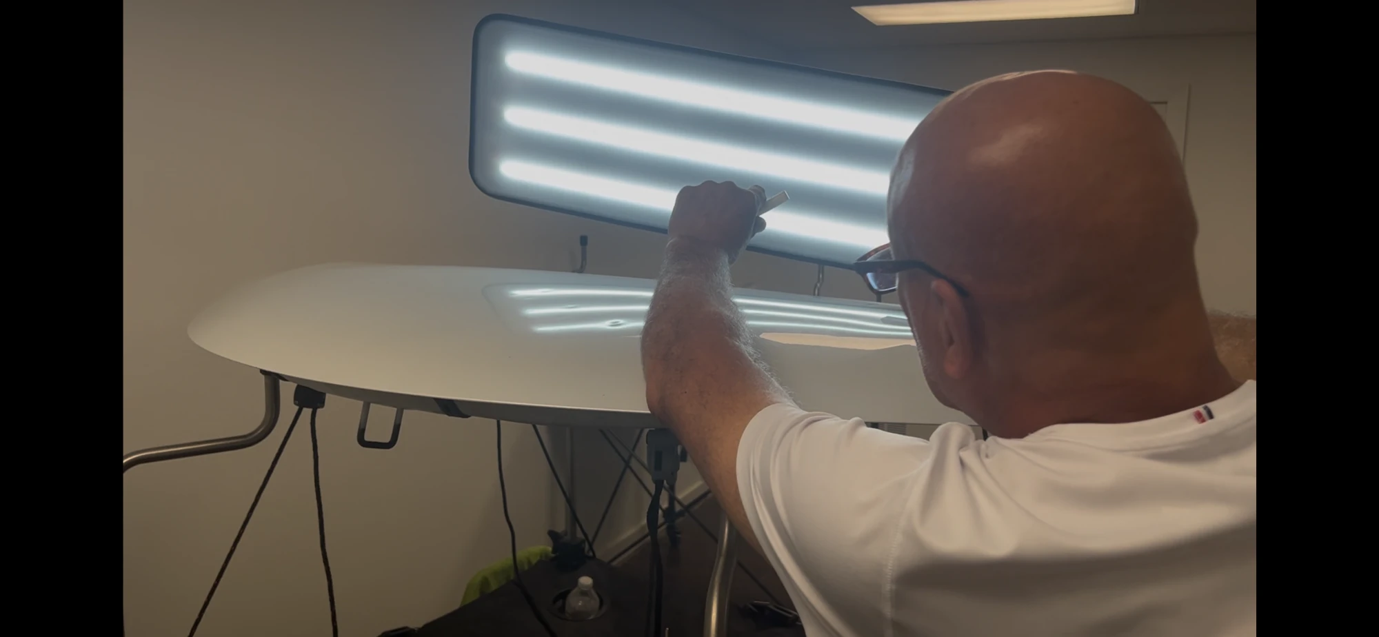 A DriveUp technician performing precision paintless dent repair